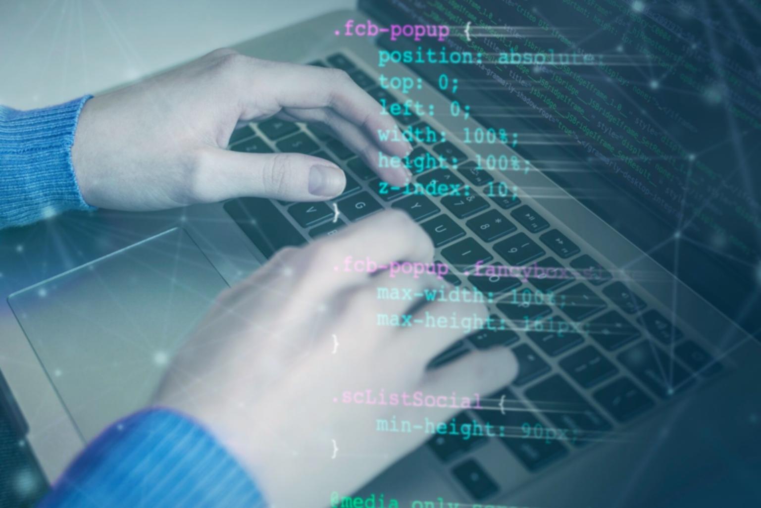 Students working on neural network implementations in computer lab